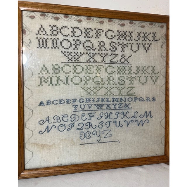 Up for sale is a rare antique 19th century handmade needlepoint sampler. The sampler is done with elaborate detailing...