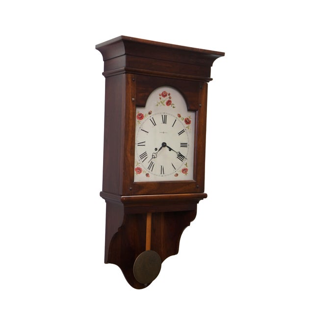 This magnificent vintage Howard Miller mahogany wall clock (Model 613-596) showcases the timeless sophistication of...
