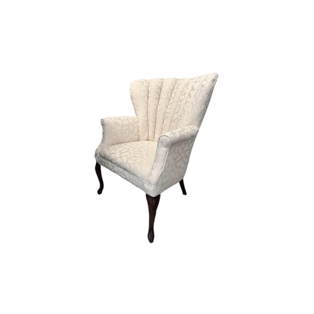 Queen Ann Style Wingback Chair. Mahogany legs, White Amelia fabric. Excellent condition. Overall dims 28 1/2"W x 30"D x 34...