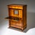 Biedermeier secretary desk in cherrywood with ebonized details and escutcheons. The case is flanked by full columns. The...