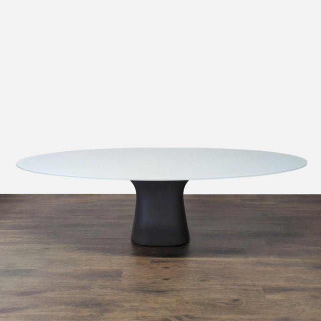 This elegant dining set from Bontempi Casa / Gallotti&Radice includes a large oval table with a sleek, frosted glass top...