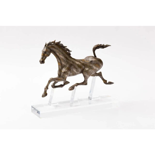 Gorgeous bronze running horse sculpture by California artist David Huenergardt.