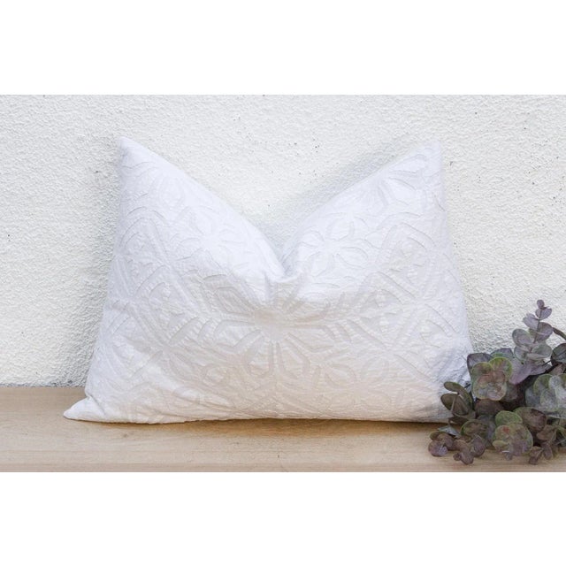 This decorative pillow cover features beautiful array of patterns, with hand crafted appliqué cut work, giving it a...
