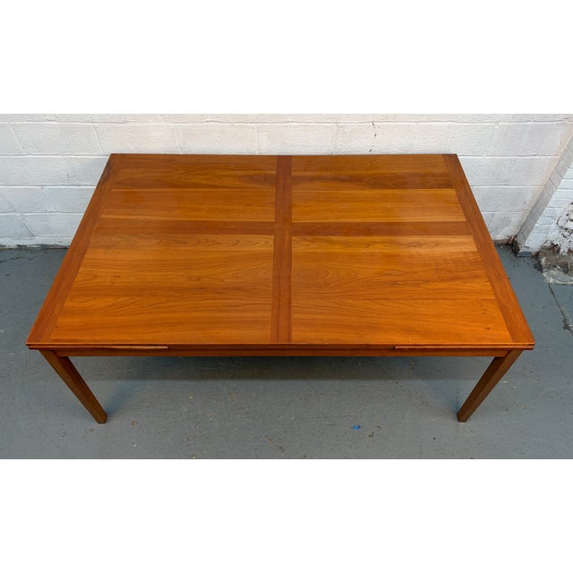 A striking example of classic Danish modern design, this large Mid-Century draw-leaf dining table by Møbler of Denmark...