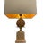 A small lamp made of gilded brass, following the design of Maison Jansen. The lamp body features a pineapple at its...