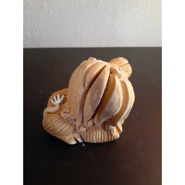 This is Artesania Rinconada 4" Handcarved Lion Figurine. Has small chip on nose as seen in picture that does not reduce...