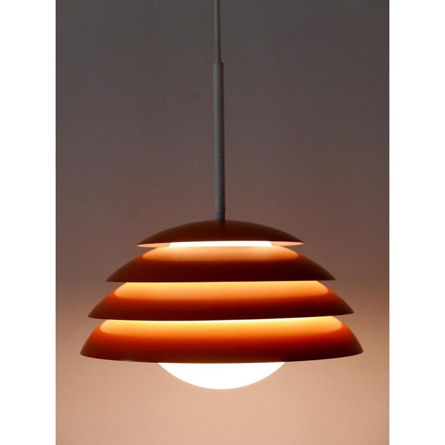 Lovely and highly decorative mid-century modern pendant lamp or hanging light. Designed and manufactured in germany,...