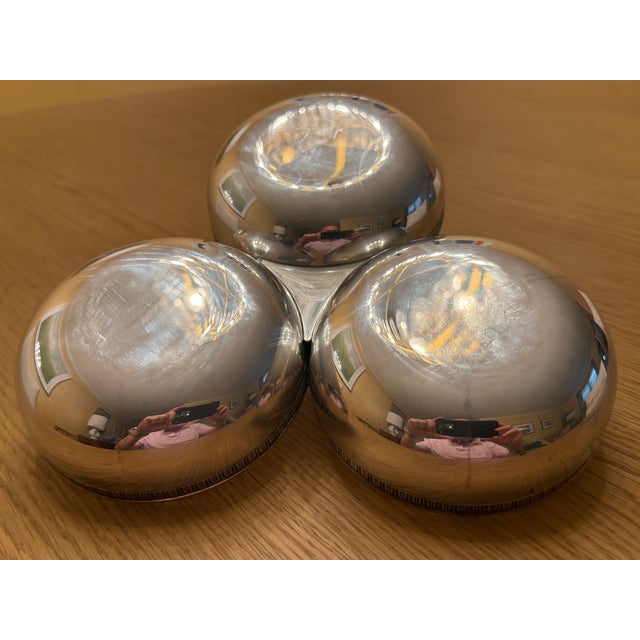 This silver-plated "Malmaison" serving dish by Christofle has three separate bowls perfect for snacks, sauces and...