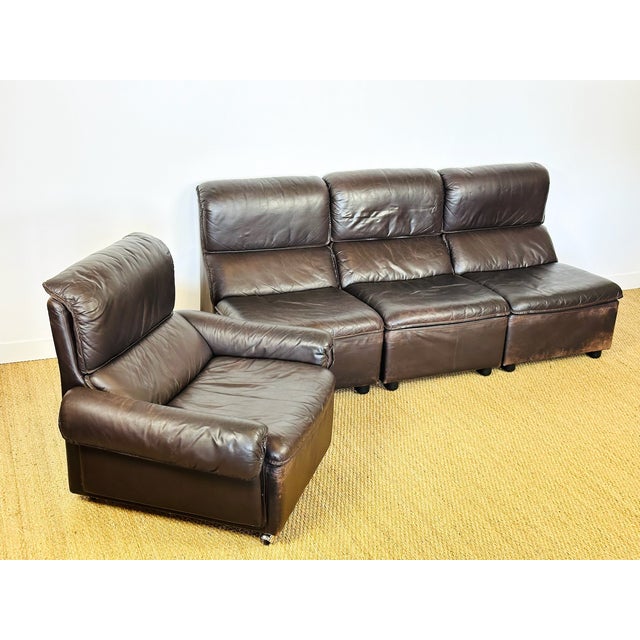 Complete living room set, modular leather sofa consisting of a 3-piece bench and an armchair dating from the 1970s. german...