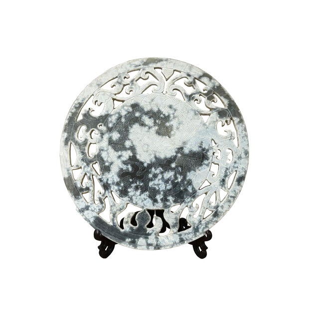 Showcase the elegance of tradition with this exquisite, hand-carved decorative plate. Crafted from what appears to be a...