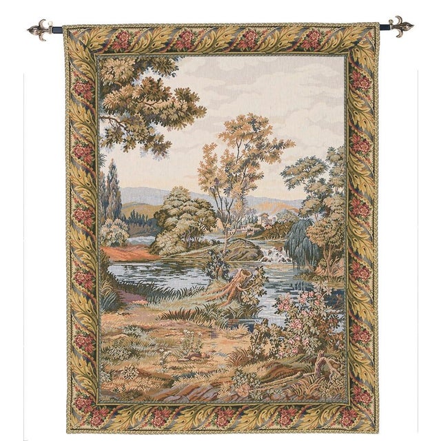 This provincial Italian landscape features a wide river gently cascading over rocks and continuing its journey through...