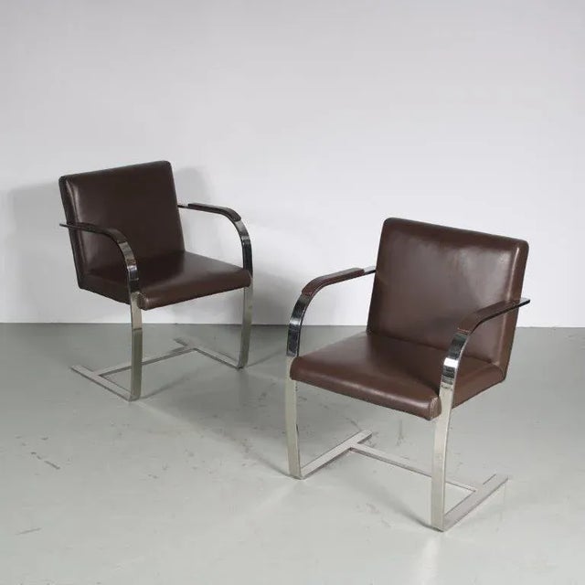 A pair of flat bar chairs, manufactured in Italy around 1970. I have official proof of authenticity such as vintage...
