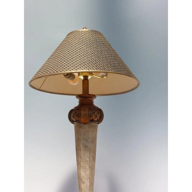 Decorative vintage table lamp by Fine Art Lamps Co., Hialeah, Florida, USA. The lamp features an elegant base with a...