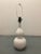 Large Midcentury white ceramic table lamp. Wired for the US and in working condition. Lamp uses a standard 100 watt bulb....