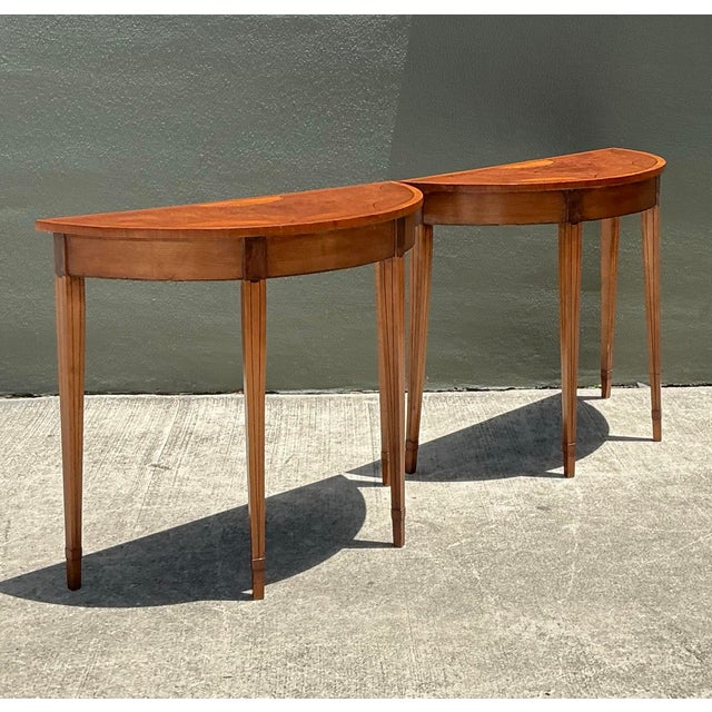Infuse your home with the timeless grace of the Neoclassical era with this exquisite pair of Regency-style demilune...