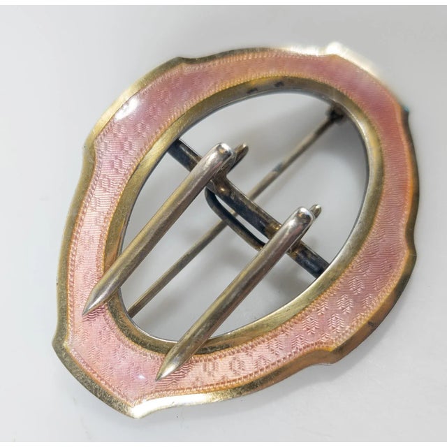 We are selling this gorgeous gilt silver belt buckle with beautiful pink guilloche enamel decoration. This belt buckle has...