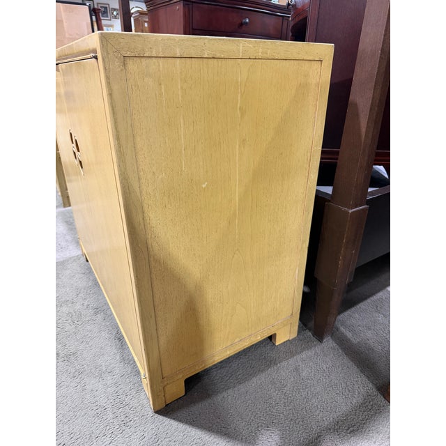 An iconic example of refined modernism infused with Eastern influence, this cabinet from the “Far East Collection” by...