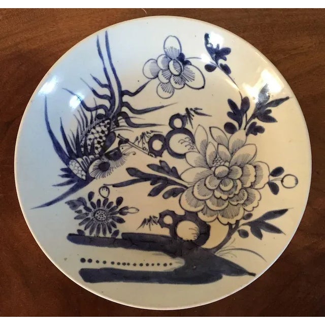Antique 19th c. Chinese blue and white porcelain charger platter or bowl. Decorated with a stylized floral scene. Measures...