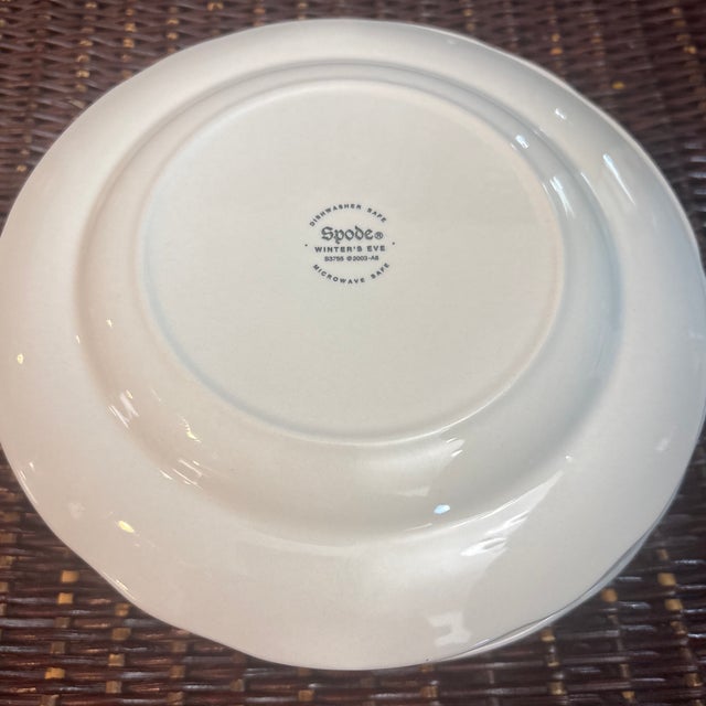 Spode Winters Eve Red 7 3/8” Salad/Dessert Plates. This pattern features a center winter pastoral scene of a snowy cabin,...