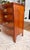 An exceptional vintage Danish bow front chest of drawers, masterfully crafted in richly figured mahogany and distinguished...