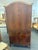 Elevate your space with this stunning pair of antique French Louis XV style armoire. Masterfully crafted from rich, warm,...