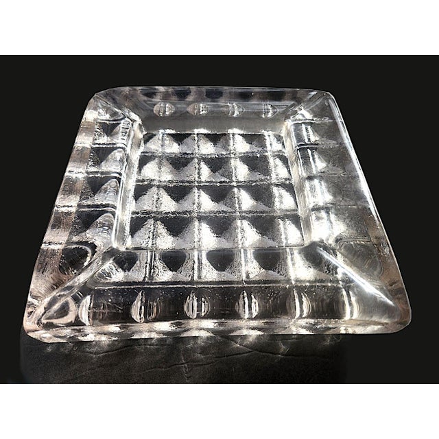 Offered is a heavy Blenko Glass Prism Ashtray designed by Don Shepherd in the 1960s. Model number 804L. It is smooth and...