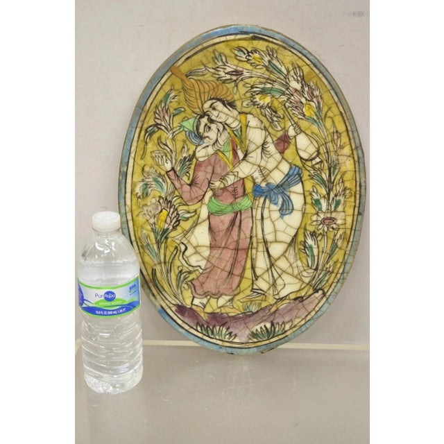 Antique Persian Iznik Qajar Style Ceramic Pottery Oval Tile Hugging Couple C3. Item features original crackle glazed...
