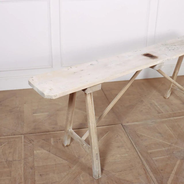 19th Century French bleached and scrubbed oak and poplar trestle table. 1880s. Top depth is 11" This piece is designed in...