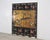 A rich and dramatic Chinese Export folding four-panel double-sided coromandel screen executed in radiant gilt and lacquer....