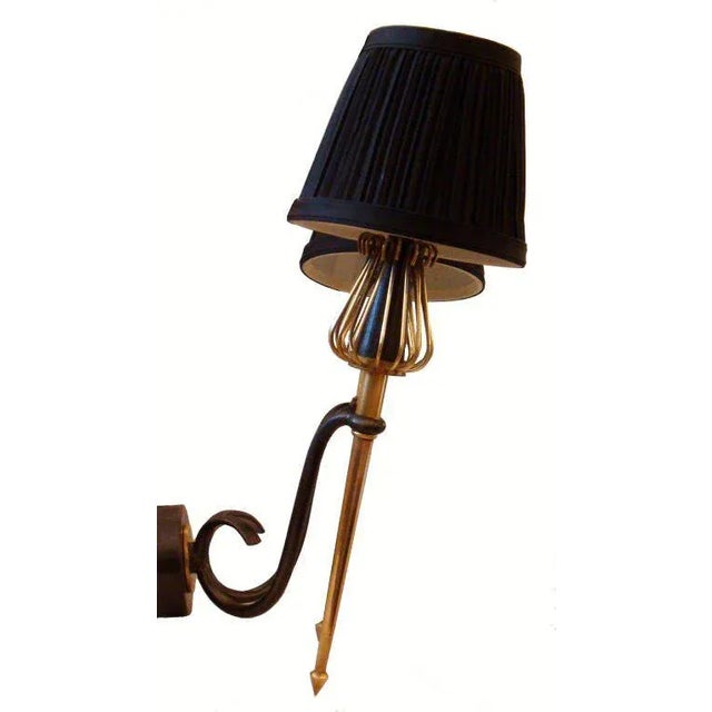 Very unique, 4 pairs available of double torch sconces. Priced by pair Two patinas gun metal and brass, by Lunel Paris...