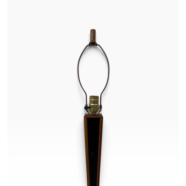 Make a bold statement with this striking Mid-Century Danish Modern black accent teak floor lamp. Featuring a tall,...