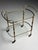 Italian mid-century serving trolley/bar cart. from the mid-20th century. with two glass shelves. Rolls well. In very good...
