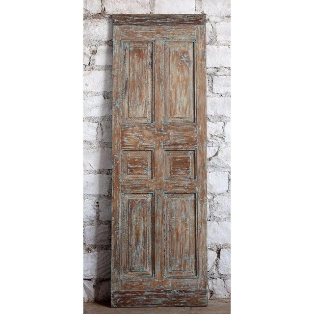 ntroduce timeless character to your space with this antique carved door, finished in a beautifully distressed blue patina...