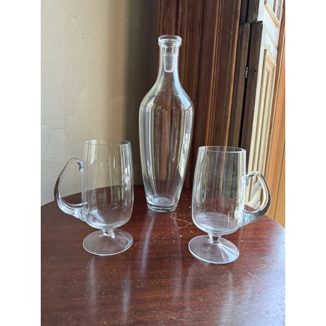 Mid century modern hand blown glass decanter, likely European production from the 1960s–1970s. Elongated ovoid body...