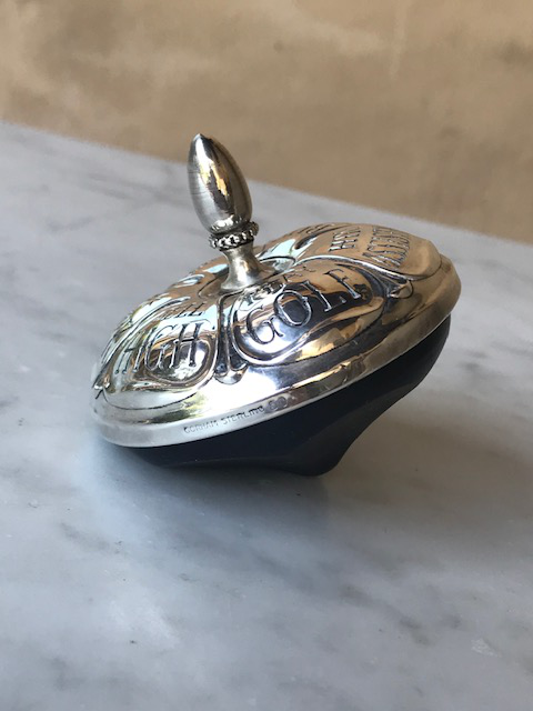 silver spinning top
