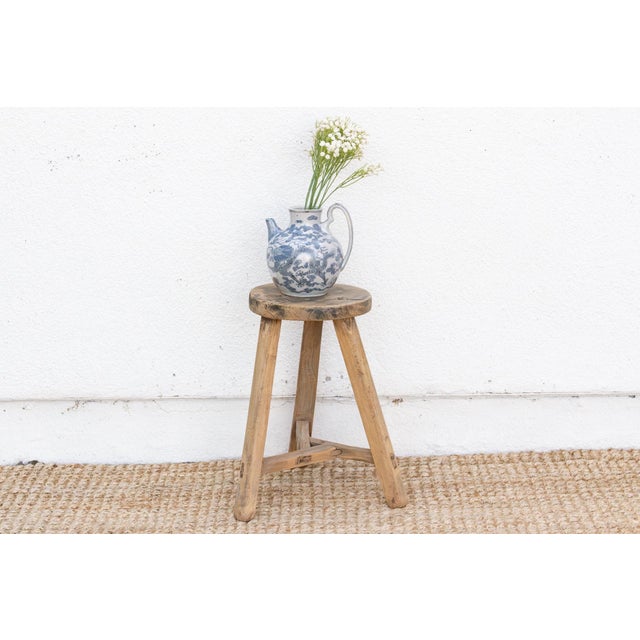 A rustic beauty, this weathered wooden round stool isn't just furniture; it's a whisper of the past. From the early 20th...