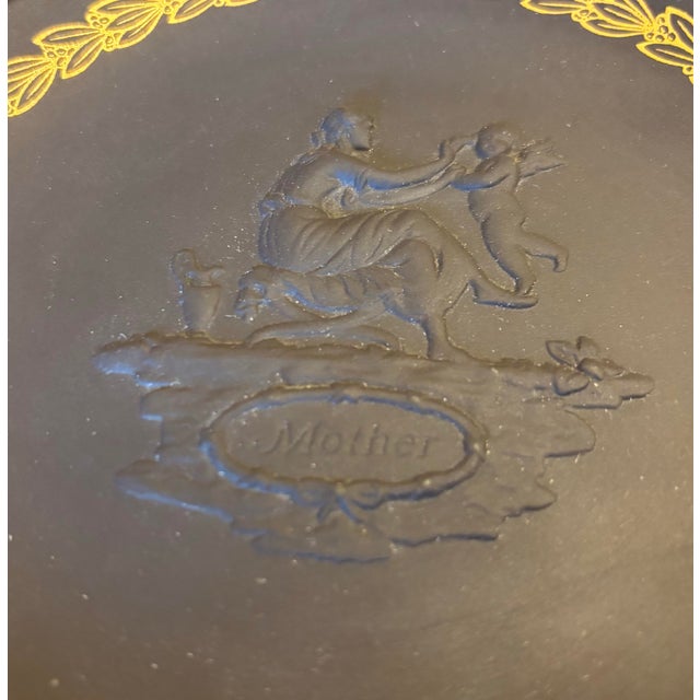 This is a beautiful Wedgewood black collectors plate. It was made in 1971 and features the relief of a mother and angel...