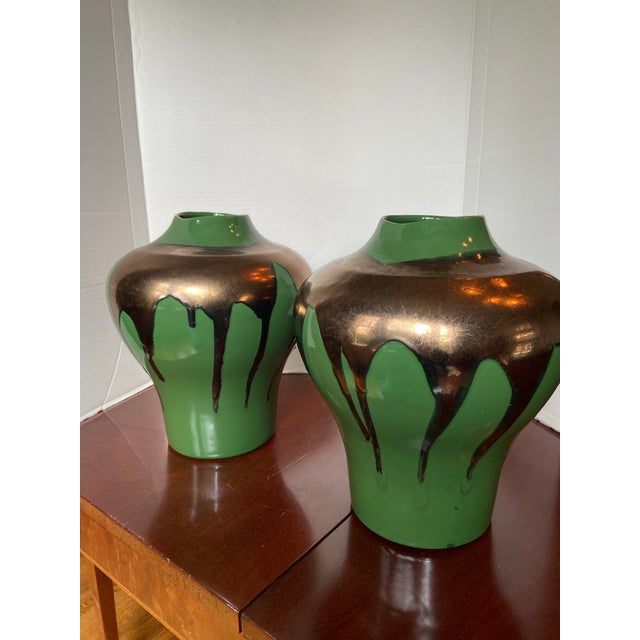 Pair of stunning Haeger lava drip glaze vases in a vivid green and bronze metallic drip glaze. Statement pieces!