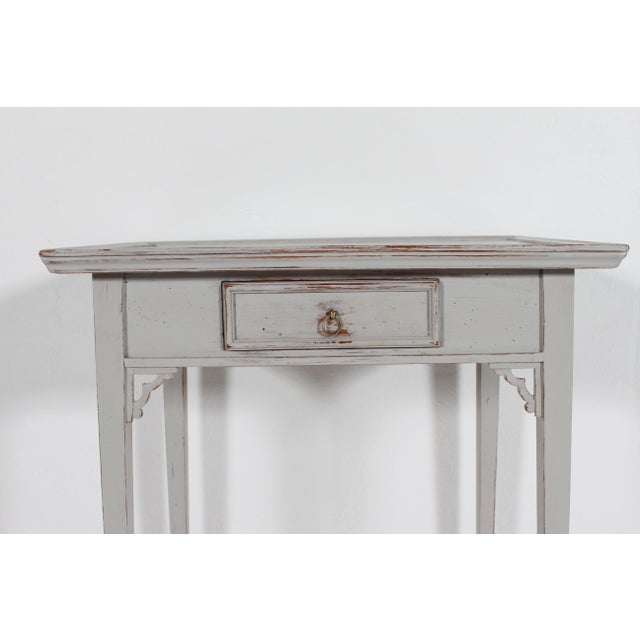 Danish Louis XVI Seize style side table with small drawer, made circa 1900 of solid pine wood by a skilled carpenter The...