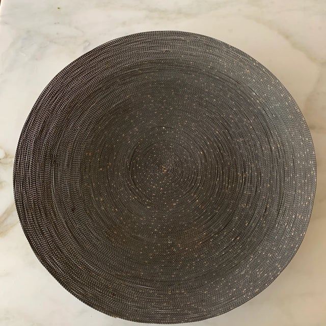 Large statement grey shallow bowl. Small embellishments of melted brass work in beautiful accord with smoky- colored iron...