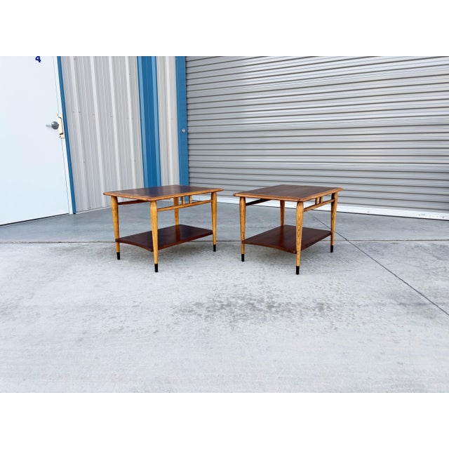 Mid-century modern walnut and oak side tables designed and manufactured by Lane Furniture in the United States, circa...