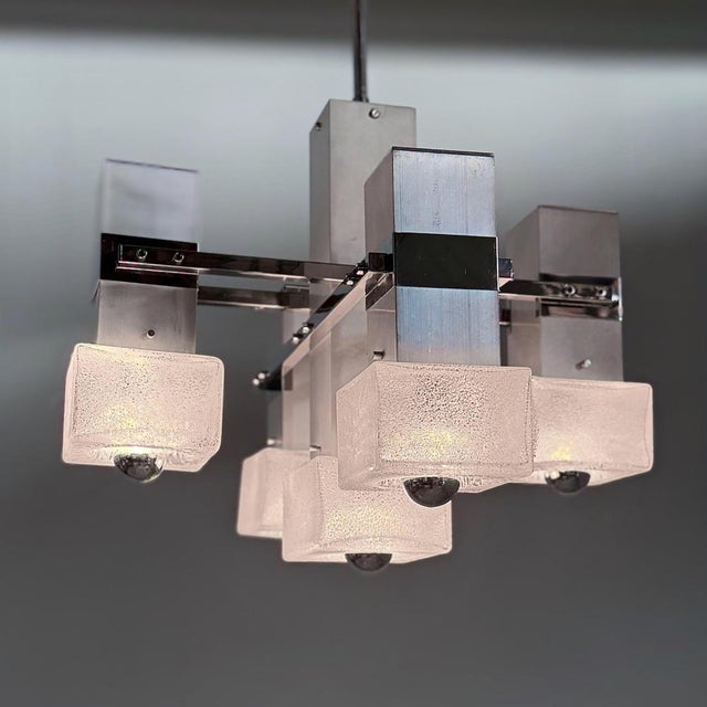 Italian cube pendant attributed to Gaetano Sciolari from the 1970s, featuring five cube-shaped glass shades. The chrome-...