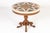 A 19th century italian walnut specimen marble top centre table. the deep circular top is inlaid with various coloured...
