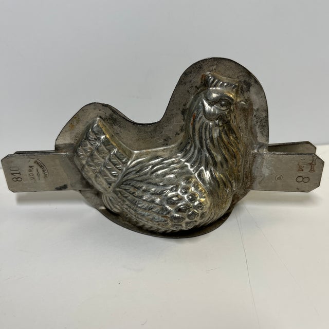 Direct from the Paris, France flea markets, a wonderful chicken sitting in a basket mold for chocolate or ice cream. Two...