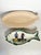 Set of two ceramic fish-shaped dishes, France, 1970s. This decorative and functional duo comprises: - a large cream-...