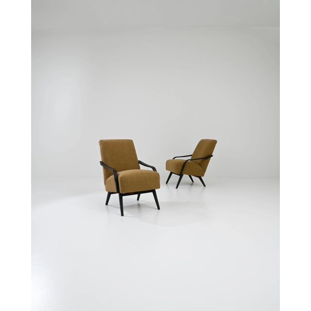 Designed and manufactured by the renowned TON furniture maker and lined in burnt caramel colors, this pair of vintage Mid-...