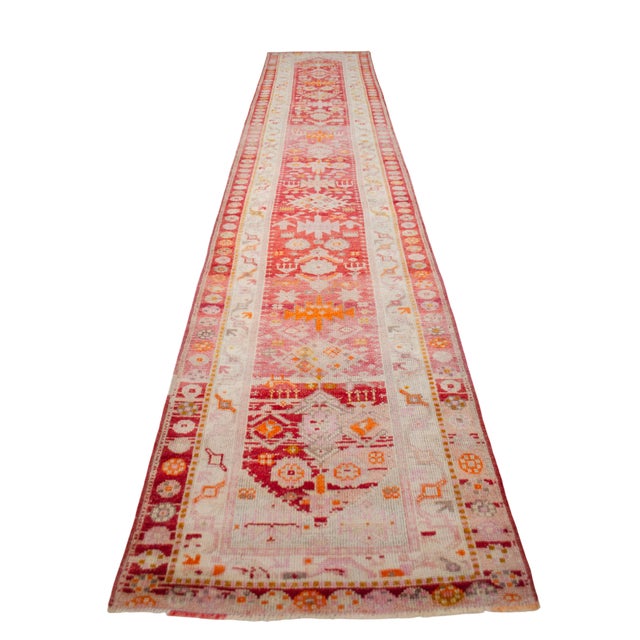 This vintage, handmade Southeastern Anatolian runner exemplifies hand-knotted pile tradition from a mid-20th century...