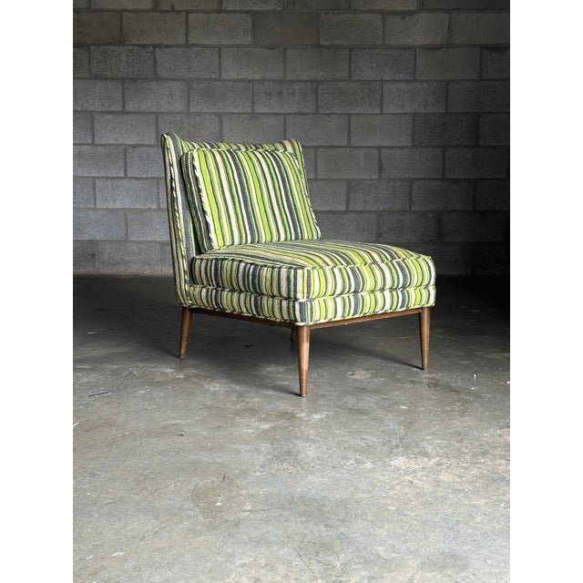 A wonderful slipper chair designed by Paul McCobb for Directional circa 1960s. Great minimalist form and silhouette....