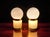 A pair of vintage table lamps in authentic Mid-Century Modern style, featuring a geometric design typical of the era. The...