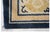 Hand-knotted in wool, this 9x11 antique Chinese rug, circa 1900, is a compelling example of East Asian textile artistry...